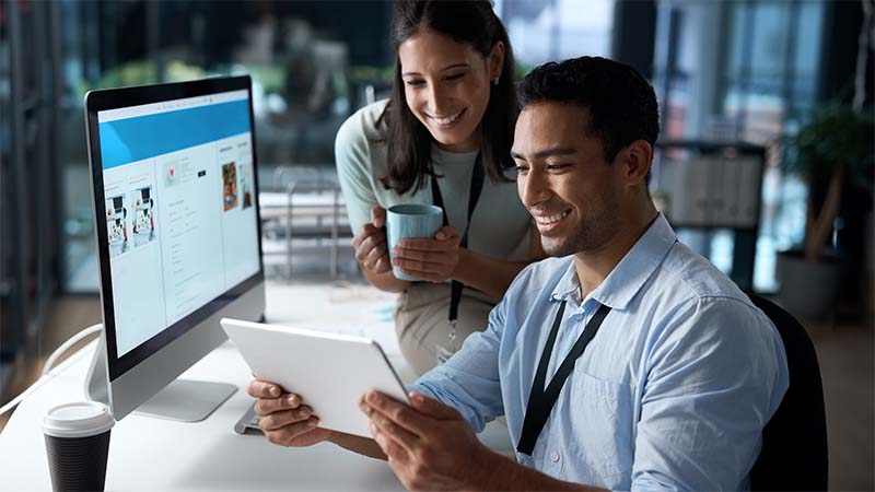 Shot Of A Young Businessman And Businesswoman Engaged Website